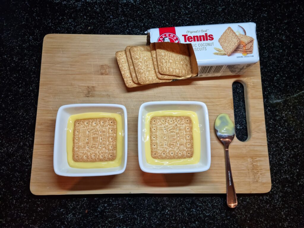 Layer the biscuits on a bed of custard